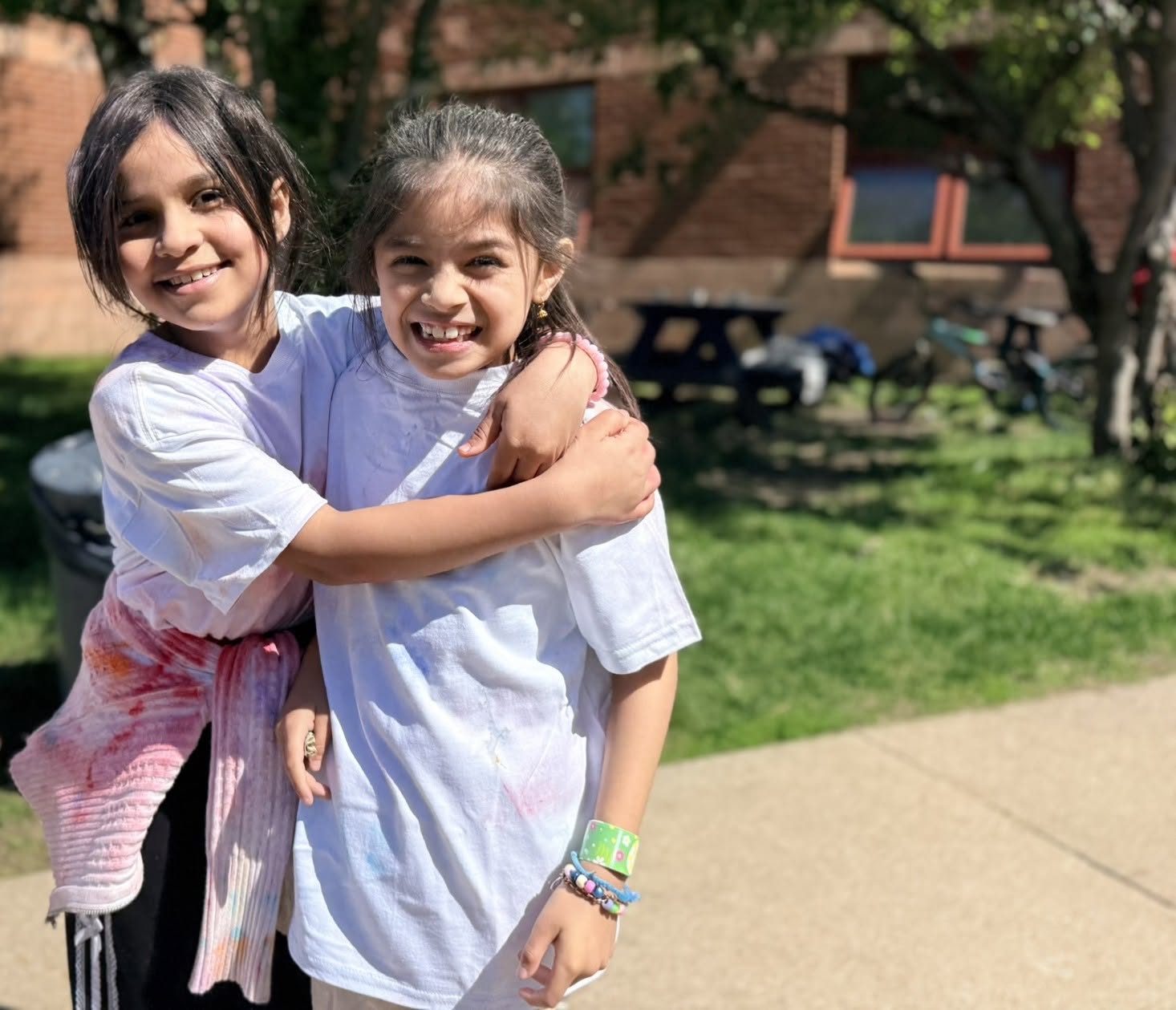 friends hugging outdoors